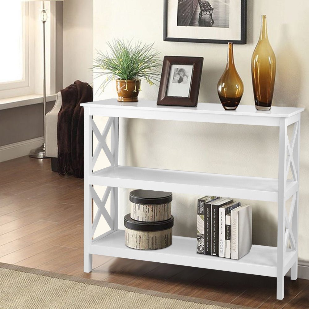 White console table with decorative items in a living room setting