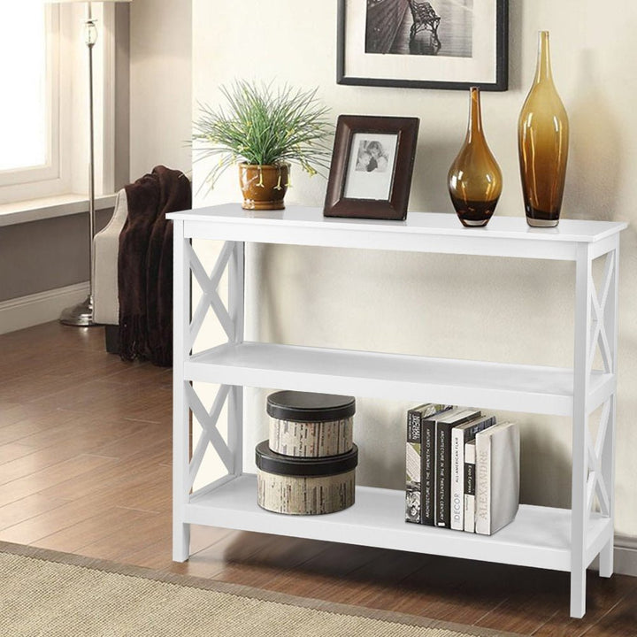 White console table with decorative items in a living room setting