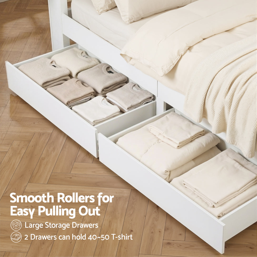 White storage drawers under a bed with folded clothes, on a wooden floor.